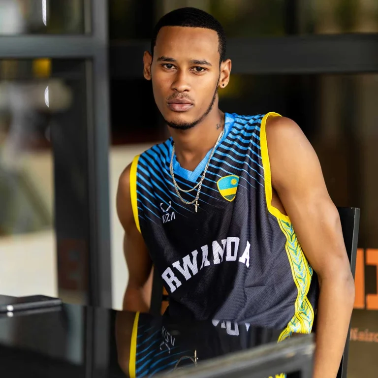 Rwandan man wearing KIZA basketball jersey with national colors and Inyambo pattern