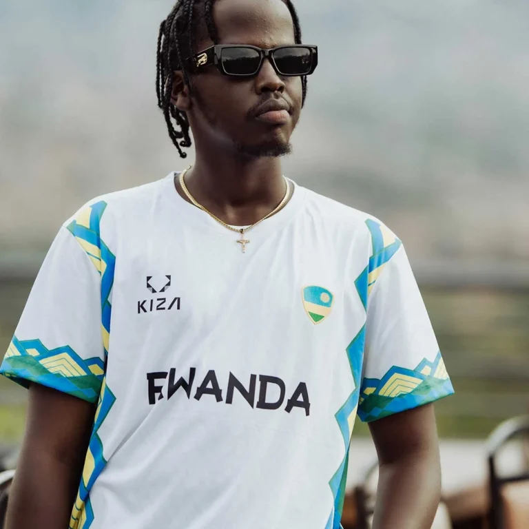 Man wearing the KIZA RWANDA WHITE jersey with modern Imigongo patterns and Rwanda flag patch